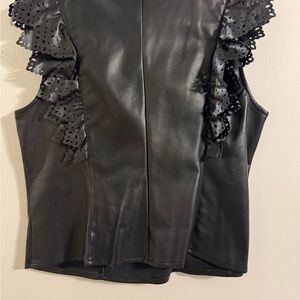 Black sleeveless top look like leathery! Ruffle & layer trim.